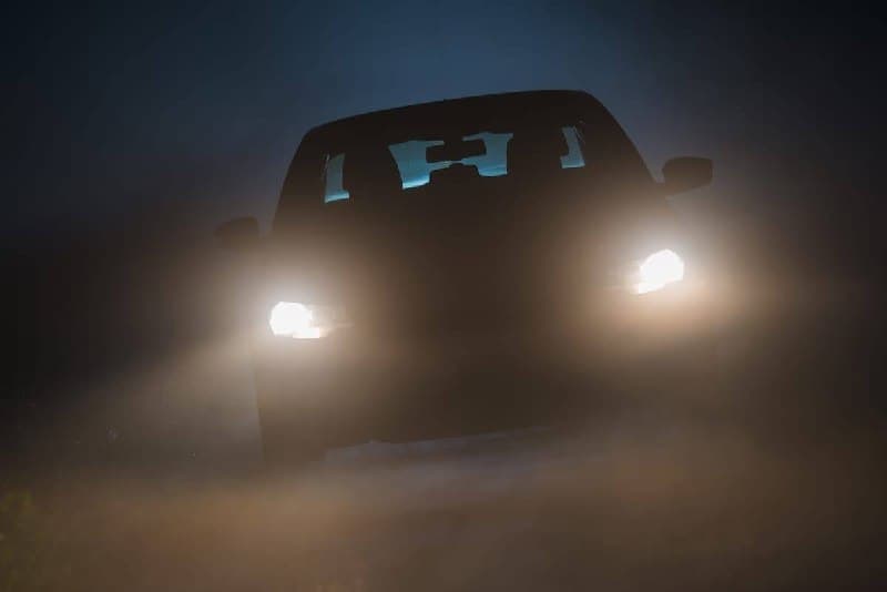 Car parked on a dark Edmonton road at night